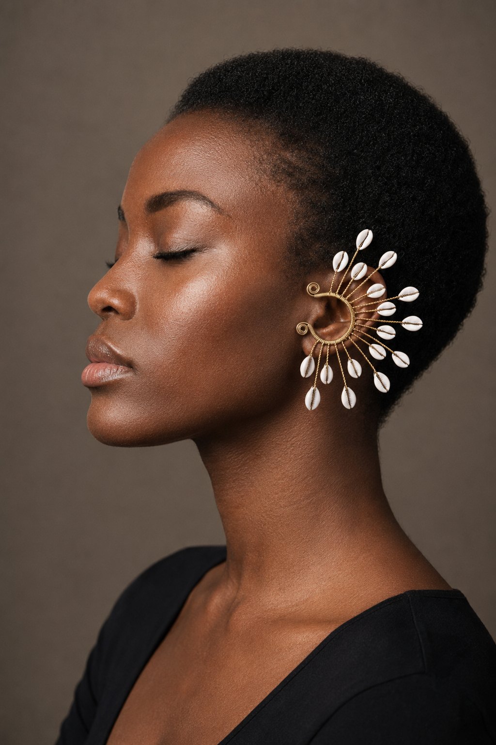Model wearing the Cowrie Sunburst Ear Cuff