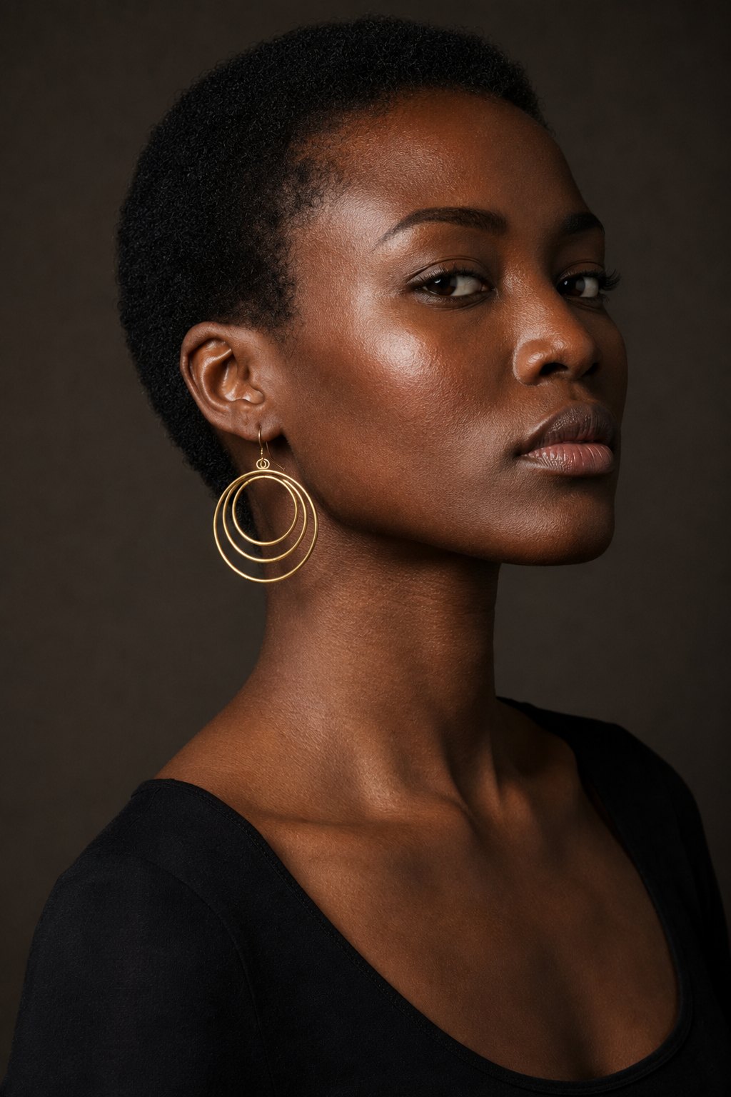 Model wearing the Triple Orbit Hoops